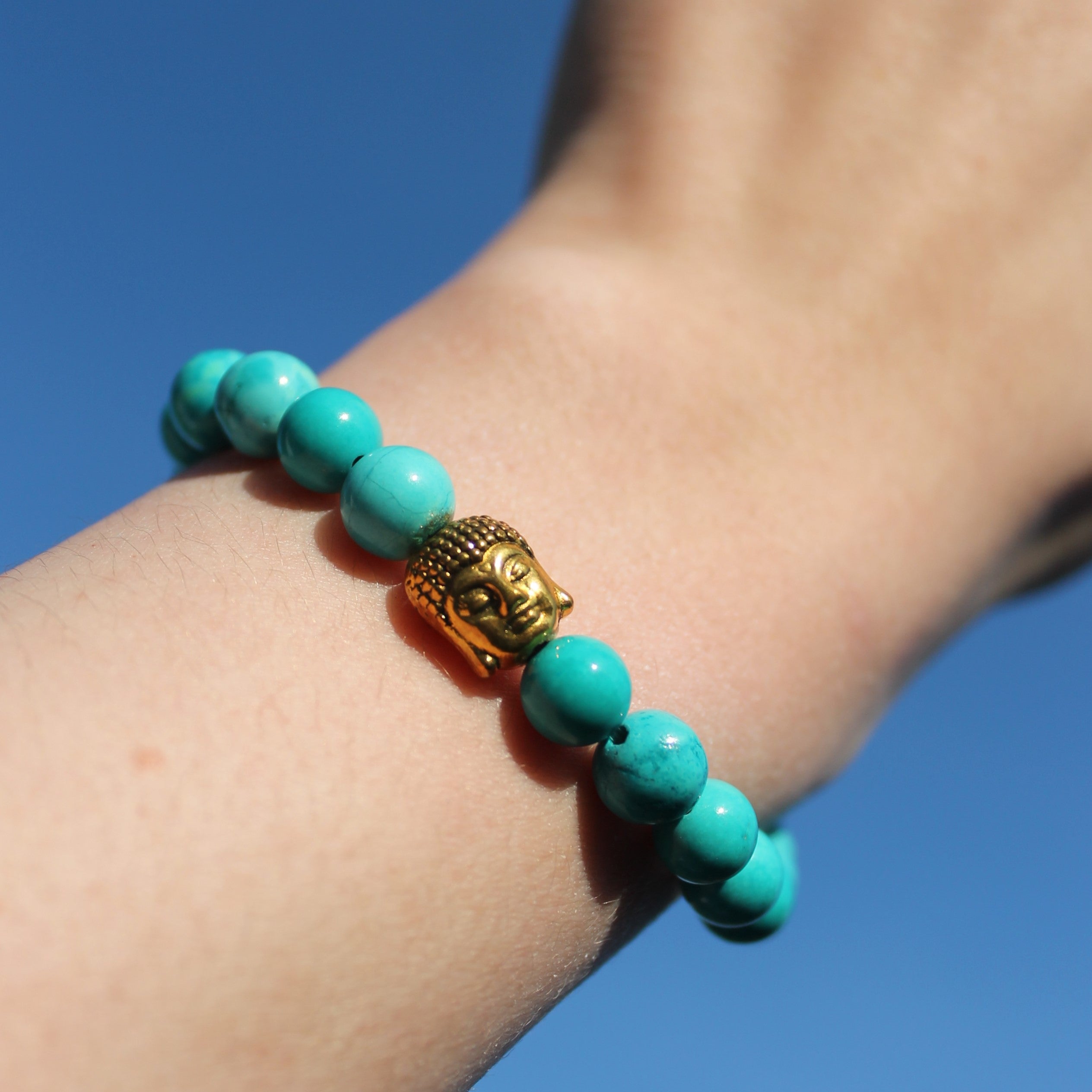 Türkis Edelsteinarmband mit Buddha goldfarben
