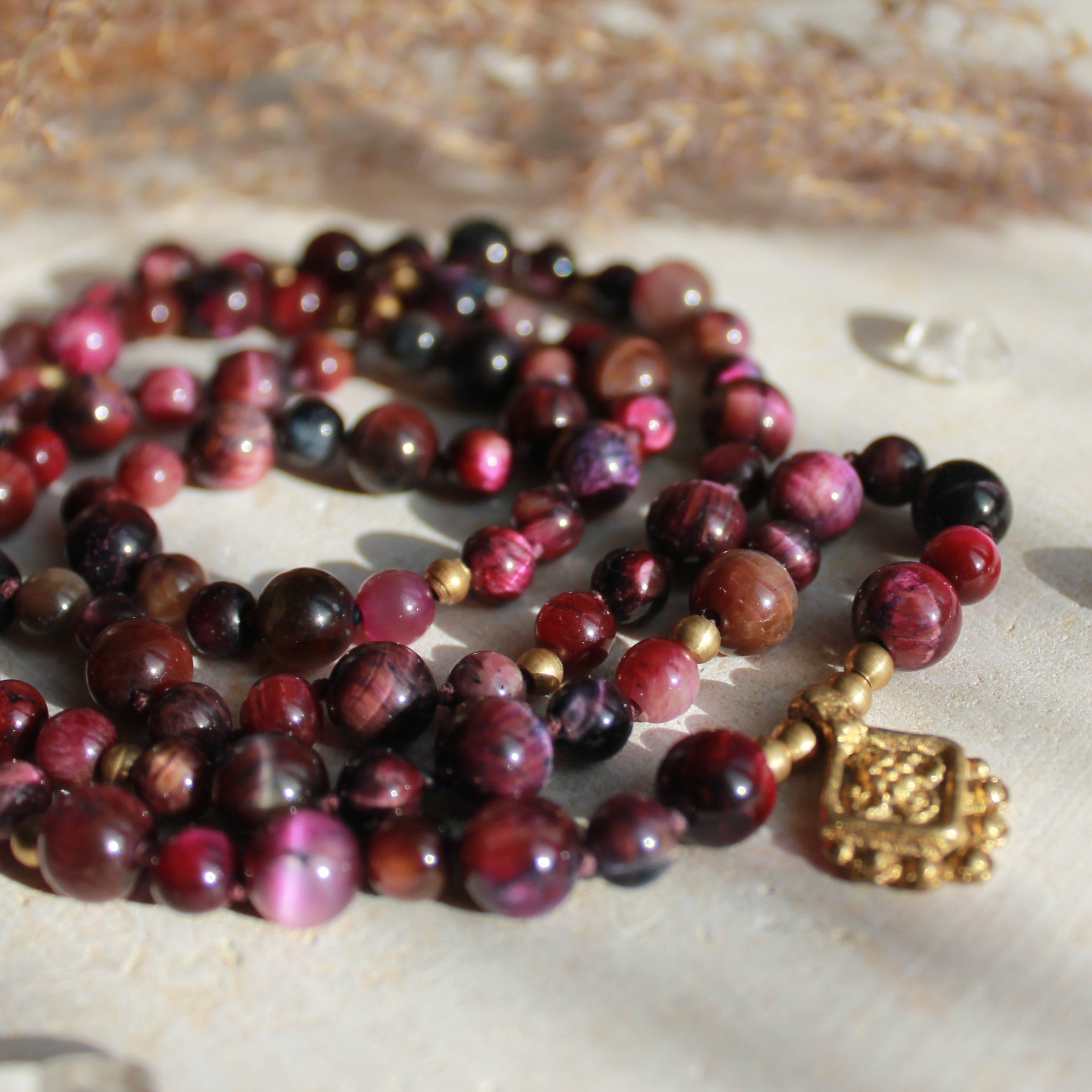 Pinker Tigerauge Mala goldfarben